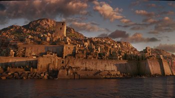 Movie still from “The Chronicles of Narnia: The Voyage of the Dawn Treader” (2010), directed by Michael Apted – A view of a city from the water at sunset; Extreme Wide shot, High angle
