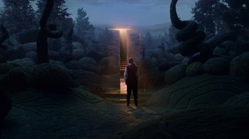 A person standing in front of an open door
