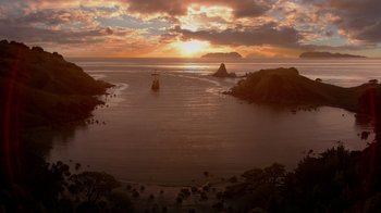 Movie still from “The Chronicles of Narnia: The Voyage of the Dawn Treader” (2010), directed by Michael Apted – A boat sailing on a body of water at sunset; Extreme Wide shot, High angle