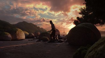 Movie still from “The Chronicles of Narnia: The Voyage of the Dawn Treader” (2010), directed by Michael Apted – A man standing on top of a beach next to rocks at sunset; Extreme Wide shot, Low angle