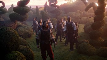 Movie still from “The Chronicles of Narnia: The Voyage of the Dawn Treader” (2010), directed by Michael Apted – A group of people standing in the grass; Wide shot, High angle