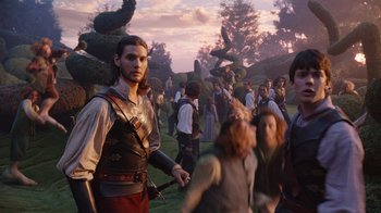Movie still from “The Chronicles of Narnia: The Voyage of the Dawn Treader” (2010), directed by Michael Apted – A group of people standing in the grass; Wide shot, Low angle
