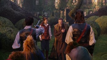 Movie still from “The Chronicles of Narnia: The Voyage of the Dawn Treader” (2010), directed by Michael Apted – A group of people standing around a building; Wide shot, Over the shoulder angle