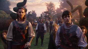 Movie still from “The Chronicles of Narnia: The Voyage of the Dawn Treader” (2010), directed by Michael Apted – A group of people standing on a lush green field; Wide shot, Low angle