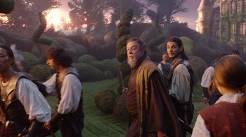 Movie still from “The Chronicles of Narnia: The Voyage of the Dawn Treader” (2010), directed by Michael Apted – A group of people walking through a forest; Medium shot, Low angle