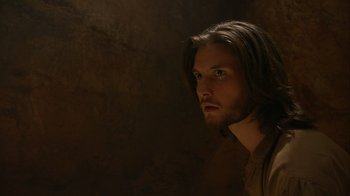 Movie still from “The Chronicles of Narnia: The Voyage of the Dawn Treader” (2010), directed by Michael Apted – A man with long brown hair stares into the distance; Close Up shot, Over the shoulder angle