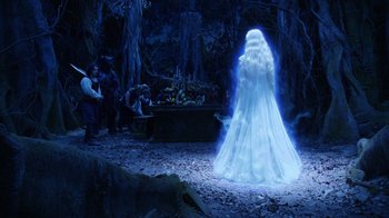 Movie still from “The Chronicles of Narnia: The Voyage of the Dawn Treader” (2010), directed by Michael Apted – A woman in a white dress standing in the woods; Wide shot, Over the shoulder angle