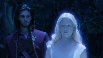 Movie still from “The Chronicles of Narnia: The Voyage of the Dawn Treader” (2010), directed by Michael Apted – A man and a woman standing next to each other in the woods; Medium shot, Over the shoulder angle