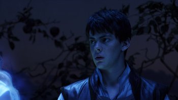 Movie still from “The Chronicles of Narnia: The Voyage of the Dawn Treader” (2010), directed by Michael Apted – A young man in a blue jacket looking to his left; Close Up shot, Low angle