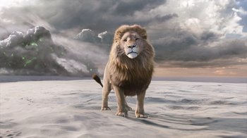 Movie still from “The Chronicles of Narnia: The Voyage of the Dawn Treader” (2010), directed by Michael Apted – A lion standing in the middle of the desert; Wide shot, Low angle