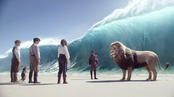 Movie still from “The Chronicles of Narnia: The Voyage of the Dawn Treader” (2010), directed by Michael Apted – A group of people standing on top of a sandy beach; Wide shot, Low angle