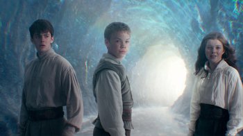 Movie still from “The Chronicles of Narnia: The Voyage of the Dawn Treader” (2010), directed by Michael Apted – A young boy standing in front of an ice cave; Medium shot, Over the shoulder angle