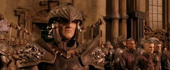 Movie still from “The Chronicles of Riddick” (2004), directed by David Twohy – A group of people dressed in metal armor and helmets; Close Up shot, Low angle