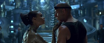 Movie still from “The Chronicles of Riddick” (2004), directed by David Twohy – A man and a woman are looking at each other; Close Up shot, Over the shoulder angle