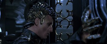 Movie still from “The Chronicles of Riddick” (2004), directed by David Twohy – A person wearing a crown; Close Up shot, Over the shoulder angle