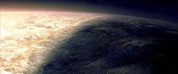 Movie still from “The Chronicles of Riddick” (2004), directed by David Twohy – An aerial view of the earth at night; Extreme Wide shot, Overhead angle