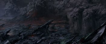 Movie still from “The Chronicles of Riddick” (2004), directed by David Twohy – An image of an image of a volcano with lava coming out of it; Extreme Wide shot, High angle
