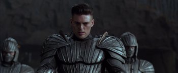 Movie still from “The Chronicles of Riddick” (2004), directed by David Twohy – A person wearing a suit of armor; Close Up shot, Low angle