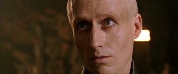 Movie still from “The Chronicles of Riddick” (2004), directed by David Twohy – A man's eyes and face; Close Up shot, Over the shoulder angle