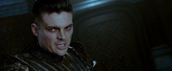 Movie still from “The Chronicles of Riddick” (2004), directed by David Twohy – A person wearing a costume; Close Up shot, Over the shoulder angle