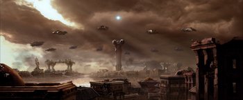 Movie still from “The Chronicles of Riddick” (2004), directed by David Twohy – An image of an alien city with a bunch of ufos flying in the sky; Extreme Wide shot, High angle