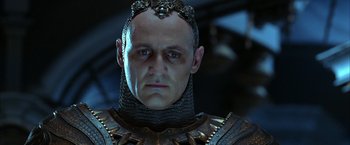 Movie still from “The Chronicles of Riddick” (2004), directed by David Twohy – A person wearing a suit of armor; Close Up shot, Low angle