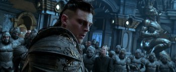 Movie still from “The Chronicles of Riddick” (2004), directed by David Twohy – A group of men standing in front of each other; Close Up shot, Over the shoulder angle