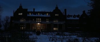 Movie still from “The Cider House Rules” (1999), directed by Lasse Hallström – A large house with a lot of snow on the ground; Extreme Wide shot, Low angle
