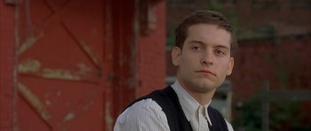 Movie still from “The Cider House Rules” (1999), directed by Lasse Hallström – A man in a vest and a white dress shirt; Close Up shot, Low angle