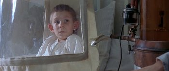 Movie still from “The Cider House Rules” (1999), directed by Lasse Hallström – A young boy looking in the mirror of a bathroom; Close Up shot, High angle
