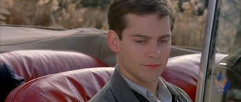 Movie still from “The Cider House Rules” (1999), directed by Lasse Hallström – A man sitting in a chair with his eyes wide open; Close Up shot, High angle
