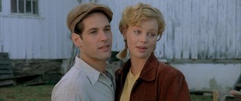 Movie still from “The Cider House Rules” (1999), directed by Lasse Hallström – A man and a woman standing next to each other; Close Up shot, Low angle