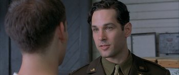 Movie still from “The Cider House Rules” (1999), directed by Lasse Hallström – A man in a uniform talking to another man in a uniform; Close Up shot, Over the shoulder angle