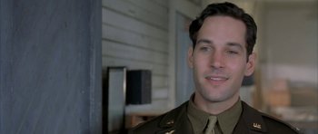 Movie still from “The Cider House Rules” (1999), directed by Lasse Hallström – A person wearing a military uniform; Close Up shot, Low angle