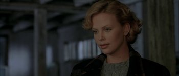 Movie still from “The Cider House Rules” (1999), directed by Lasse Hallström – Charlize theron in a scene from the movie; Close Up shot, Over the shoulder angle