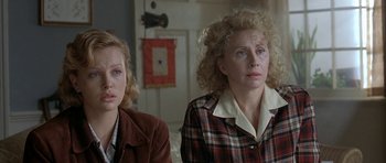 Movie still from “The Cider House Rules” (1999), directed by Lasse Hallström – Two women sitting next to each other in a room; Close Up shot, Over the shoulder angle