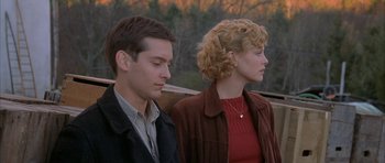 Movie still from “The Cider House Rules” (1999), directed by Lasse Hallström – A man and a woman sitting next to each other on a park bench; Medium shot, Over the shoulder angle