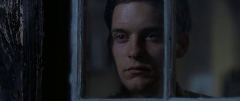 Movie still from “The Cider House Rules” (1999), directed by Lasse Hallström – A man looking out of a window at night; Close Up shot, Low angle