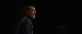 Movie still from “The Circle” (2017), directed by James Ponsoldt – A person with a beard on a black background; Close Up shot, Low angle