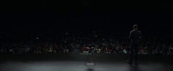 Movie still from “The Circle” (2017), directed by James Ponsoldt – An audience is watching a stand - up comedy show; Extreme Wide shot, High angle