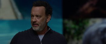 Movie still from “The Circle” (2017), directed by James Ponsoldt – A man with a gray beard is looking to his left; Close Up shot, Over the shoulder angle