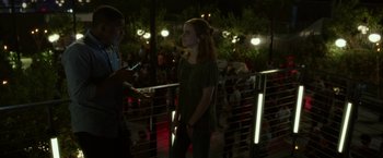 Movie still from “The Circle” (2017), directed by James Ponsoldt – A woman standing next to a man on a bridge; Medium shot, Over the shoulder angle