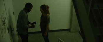 Movie still from “The Circle” (2017), directed by James Ponsoldt – A man and a woman are standing in a room; Medium shot, Low angle