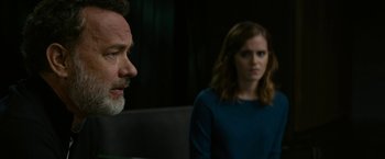 Movie still from “The Circle” (2017), directed by James Ponsoldt – A man and a woman are sitting in front of each other; Close Up shot, Over the shoulder angle