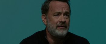 Movie still from “The Circle” (2017), directed by James Ponsoldt – An older man with a gray beard looks at the camera; Close Up shot, Low angle