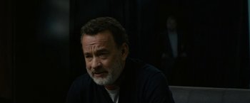 Movie still from “The Circle” (2017), directed by James Ponsoldt – An older man with a beard is sitting in a dark room; Close Up shot, Over the shoulder angle
