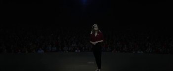 Movie still from “The Circle” (2017), directed by James Ponsoldt – A woman standing in front of an audience in front of a crowd; Extreme Wide shot, High angle