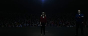 Movie still from “The Circle” (2017), directed by James Ponsoldt – A woman standing in front of an audience in front of a crowd; Extreme Wide shot, Low angle