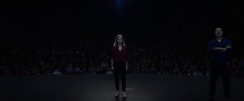Movie still from “The Circle” (2017), directed by James Ponsoldt – A woman standing in front of an audience in front of a crowd; Extreme Wide shot, High angle