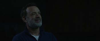 Movie still from “The Circle” (2017), directed by James Ponsoldt – A man with a gray beard is looking up; Close Up shot, Over the shoulder angle